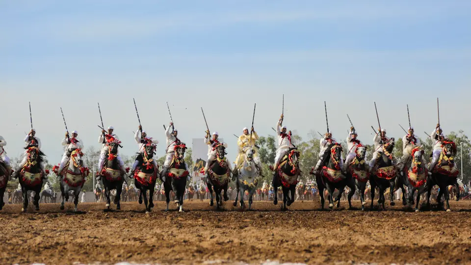 Horsemen lined up for a tbourida, the Moroccan fantasia