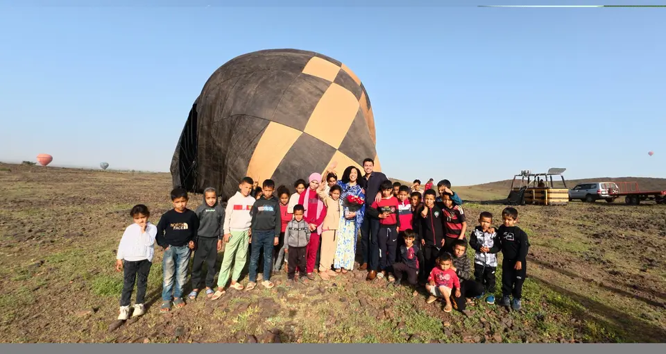 A group beside a balloon after landing