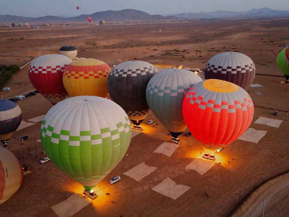 Balloons being inflated before dawn, seen from above