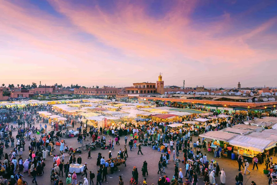Jemaa el-Fna in the evening with the Koutoubia behind, Marrakech