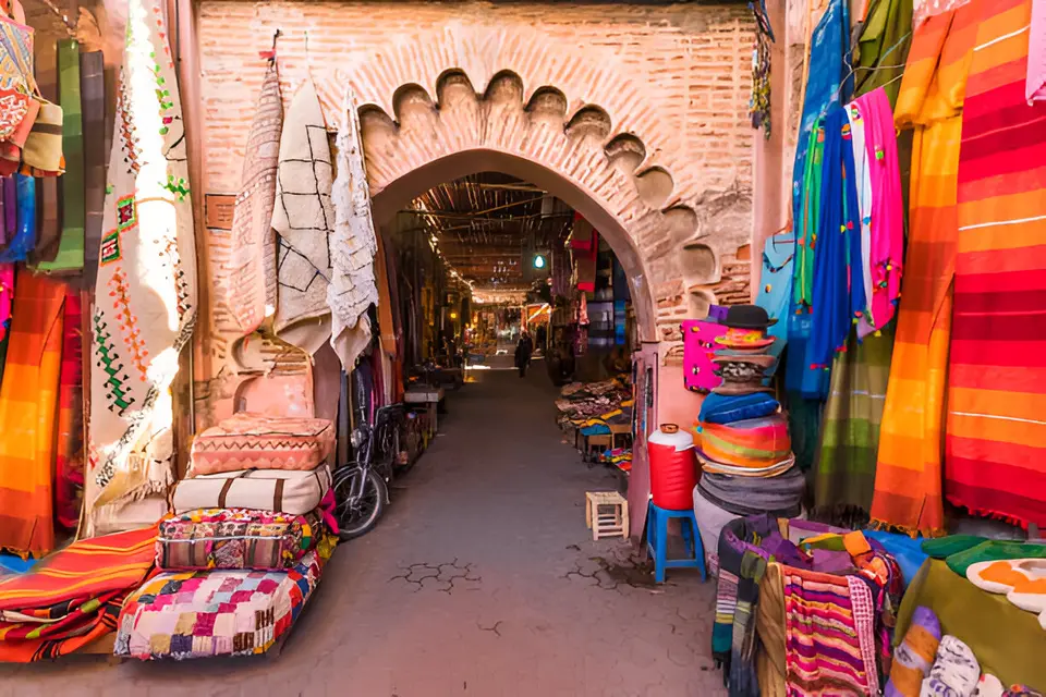An arched souk gateway hung with textiles, Marrakech
