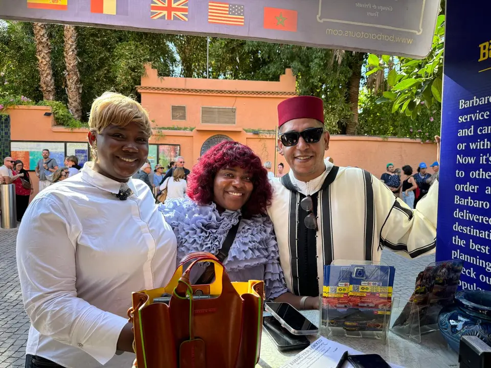 Guests with their guide at a market stall